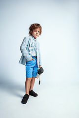 Image showing Pretty young boy in casual clothes on white studio background