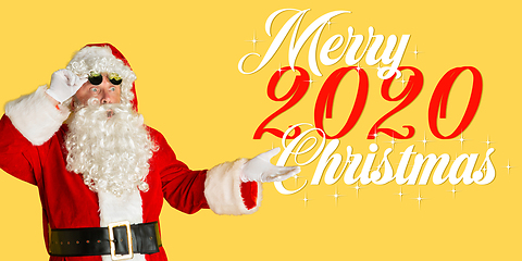 Image showing Santa Claus isolated on yellow studio background