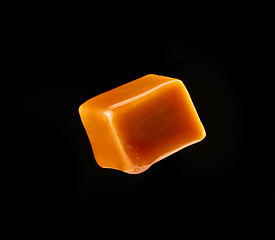 Image showing caramel candy on black background