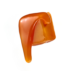 Image showing caramel sauce flowing on flying caramel candy