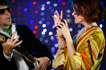 Image showing Female singer and male guitar player