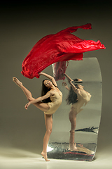 Image showing Young and stylish modern ballet dancer on brown background