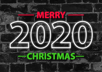 Image showing 2020 in neon multi colour, parallel lines pattern on black brick background