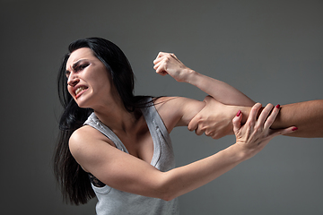 Image showing Woman being under domestic abuse and violence, concept of female rights