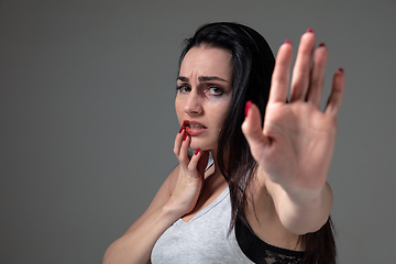 Image showing Woman in fear of domestic abuse and violence, concept of female rights