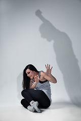 Image showing Woman being under domestic abuse and violence, concept of female rights