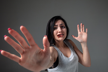 Image showing Woman in fear of domestic abuse and violence, concept of female rights