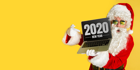 Image showing Santa Claus isolated on yellow studio background