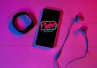 Image showing Top view of set of gadgets in purple neon light