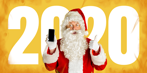 Image showing Santa Claus isolated on yellow studio background