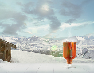 Image showing Mulled wine and landscape of mountains on background