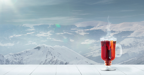 Image showing Mulled wine and landscape of mountains on background