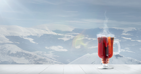 Image showing Mulled wine and landscape of mountains on background