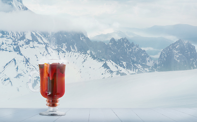 Image showing Mulled wine and landscape of mountains on background