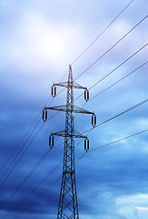 Image showing High voltage tower against the evening cloudy sky