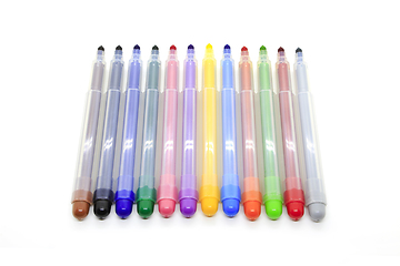 Image showing Open multicolored markers on a white background