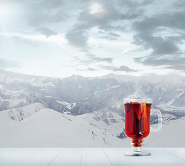 Image showing Mulled wine and landscape of mountains on background