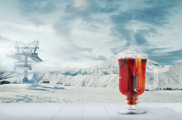 Image showing Mulled wine and landscape of mountains on background