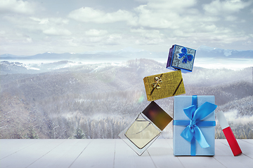 Image showing Gifts for family and landscape of mountains on background