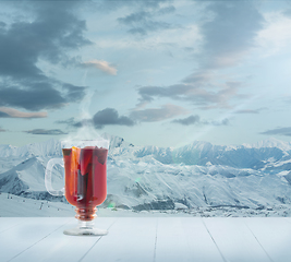 Image showing Mulled wine and landscape of mountains on background