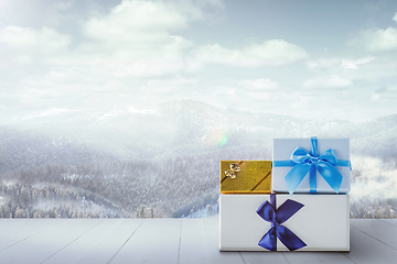 Image showing Gifts for family and landscape of mountains on background