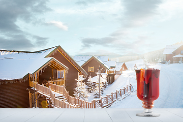 Image showing Mulled wine and landscape of mountains on background