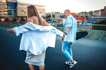 Image showing Tanned young caucasian couple, modern lovestory in film grain effect