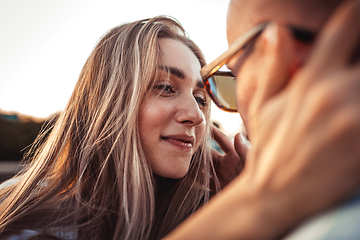 Image showing Tanned young caucasian couple, modern lovestory in film grain effect