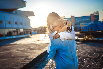 Image showing Tanned young caucasian couple, modern lovestory in film grain effect