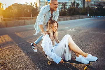 Image showing Tanned young caucasian couple, modern lovestory in film grain effect