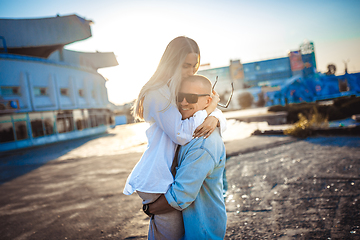 Image showing Tanned young caucasian couple, modern lovestory in film grain effect