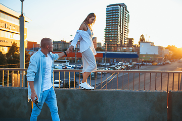 Image showing Tanned young caucasian couple, modern lovestory in film grain effect