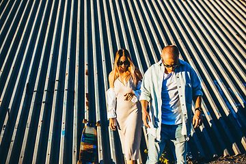 Image showing Tanned young caucasian couple, modern lovestory in film grain effect