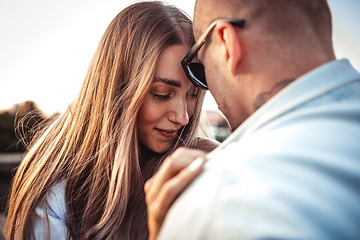 Image showing Tanned young caucasian couple, modern lovestory in film grain effect