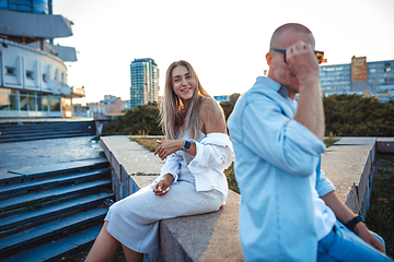 Image showing Tanned young caucasian couple, modern lovestory in film grain effect