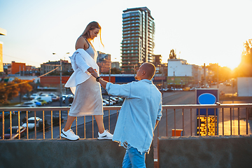 Image showing Tanned young caucasian couple, modern lovestory in film grain effect