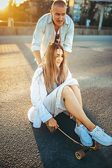 Image showing Tanned young caucasian couple, modern lovestory in film grain effect