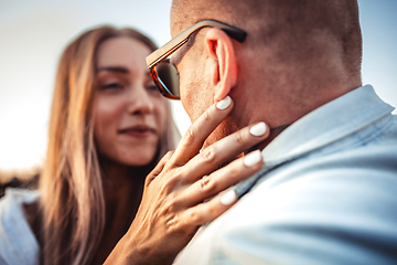 Image showing Tanned young caucasian couple, modern lovestory in film grain effect