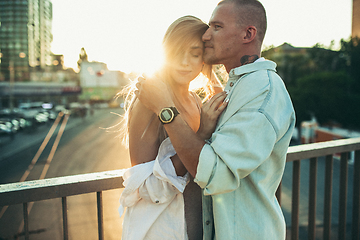 Image showing Tanned young caucasian couple, modern lovestory in film grain effect