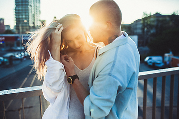 Image showing Tanned young caucasian couple, modern lovestory in film grain effect