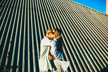 Image showing Tanned young caucasian couple, modern lovestory in film grain effect