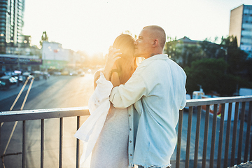 Image showing Tanned young caucasian couple, modern lovestory in film grain effect