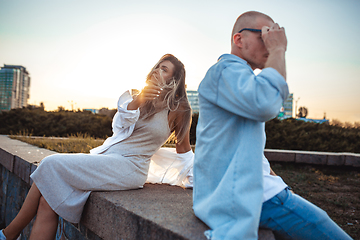 Image showing Tanned young caucasian couple, modern lovestory in film grain effect