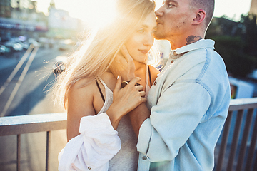 Image showing Tanned young caucasian couple, modern lovestory in film grain effect