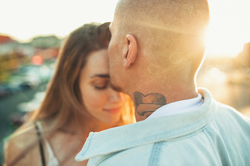 Image showing Tanned young caucasian couple, modern lovestory in film grain effect