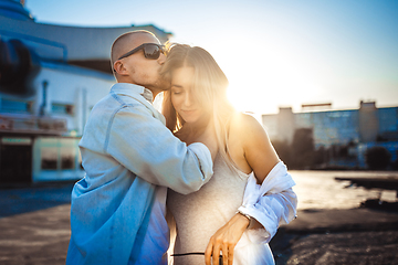 Image showing Tanned young caucasian couple, modern lovestory in film grain effect