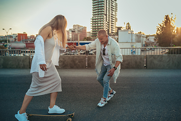 Image showing Tanned young caucasian couple, modern lovestory in film grain effect