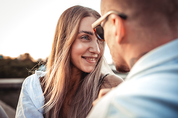 Image showing Tanned young caucasian couple, modern lovestory in film grain effect