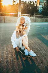 Image showing Tanned young caucasian couple, modern lovestory in film grain effect