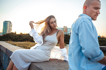 Image showing Tanned young caucasian couple, modern lovestory in film grain effect